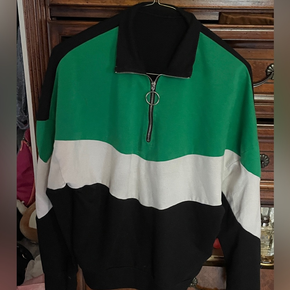 black, green, and white sweatshirt with zipper